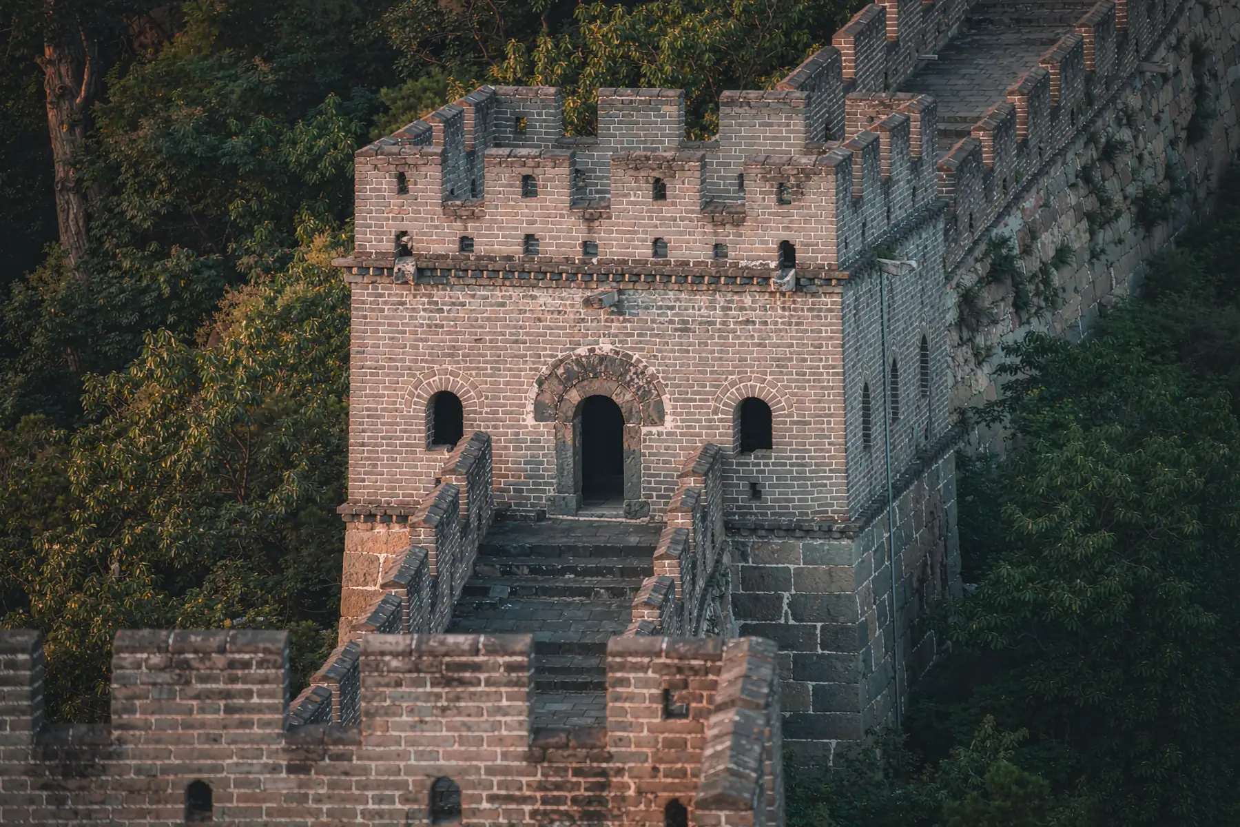 Close view of a Mutianyu watchtower with flat crenellated roof — Beijing private tour